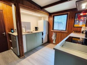 a kitchen with a white refrigerator and a sink at 4 star holiday home in Ry in Ry