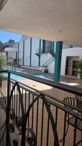 a balcony with a view of a swimming pool at Hotel María del Carmen in Jalpan de Serra