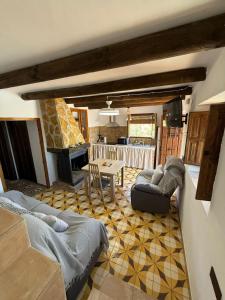 a living room with a couch and a table at Cortijo El Nevazo II in Fuentes de Cesna +20 photos