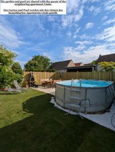 a swimming pool in the backyard of a house at Bonito - Historischer Streckhof in Schützen am Gebirge