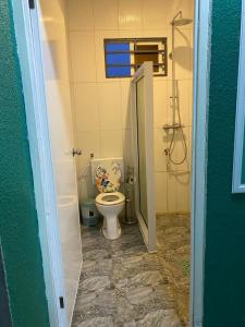 a bathroom with a toilet in a room at Augi's Rental in Onverwacht +48 photos