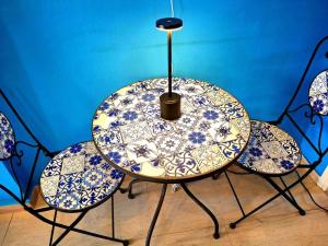 a table with blue and white plates on it at SuiteArtate in Patra
