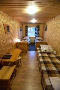Ein Bett oder Betten in einem Zimmer der Unterkunft Turbaza Shuyezero