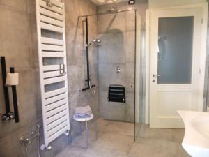 a bathroom with a shower and a glass shower stall at Cascina Sant'Eufemia in Sinio +58 photos