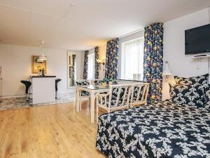a bedroom with a bed and a desk in a room at Holiday home in Marstal in Brovst