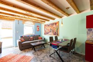 a living room with a couch and a table at Mexican-themed holiday homes in Debina