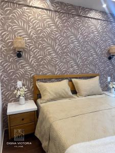 a bedroom with two beds and a wall mural at Acogedorapartamento entre montañas in Pedro Brand +1 photo