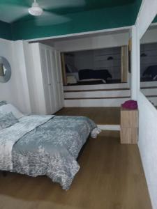a bedroom with a bed and a window at Cocoon apartment with garden, quiet in Simpson Bay