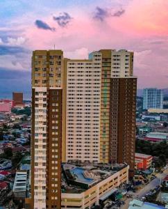 a group of tall buildings in a city at B4B Staycation Avida Aspira in Cagayan de Oro