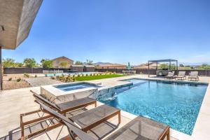 a swimming pool with lounge chairs and a swimming poolvisorvisor at CIELO - Modern Vegas Pool Oasis, Spa, Pickleball in Las Vegas