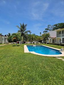 a swimming pool in the yard of a house at Casa Amarilla in Barrio Nuevo
