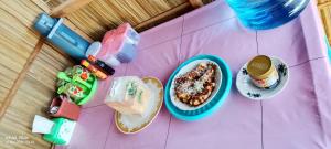 a toy table with a bowl of cereal and a plate of food at Isiie Homestay in Merpati +23 photos