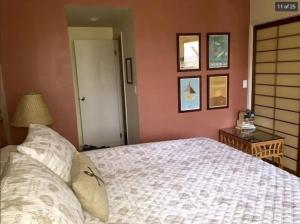a bedroom with a bed and a table with a lamp at Oceanfront with Private Beach! Hale Mahina Beach Resort A206 in Lahaina +24 photos