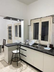 a kitchen with a sink and a counter top at Marías in Resistencia +4 photos