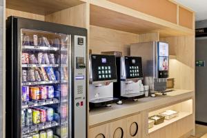 a vending machine in a store with drinks at B&B HOTEL Tarragona Centro Urbis in Tarragona