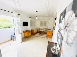 a living room with a couch and a table at spacieuse vacation appartements in Essaouira