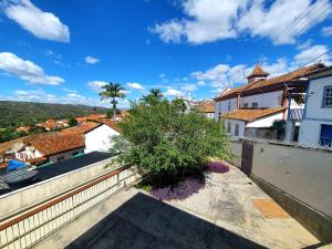 a view from the balcony of a house with a tree at Casa Antunes in Diamantina
