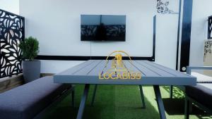 a blue table with a yellow bag on it at Locabiss 5, ALMADIES 2 in Rufisque +4 photos