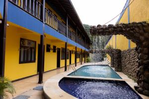 a swimming pool in the middle of a building at Bella Pousada in Abraão