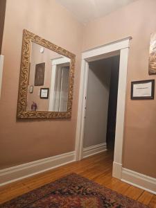 a hallway with a mirror on the wall at Waterfront The Hearding Island in Duluth