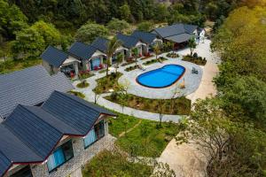 an overhead view of a house with a swimming pool at Trang An River View Ecolodge in Ninh Binh