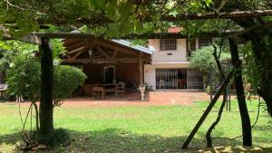 a view of a house from the yard at Quinta Arce - Refugio Natural in Trinidad