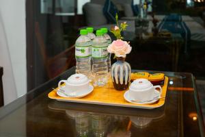 a tray with bottles of water on a table at Trang An River View Ecolodge in Ninh Binh