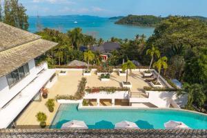 an aerial view of a resort with a swimming pool at V302 Exclusive Seaview 7BR Infinity Pool Villa in Por Bay