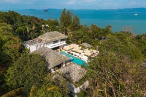 an aerial view of a villa with a swimming pool at V302 Exclusive Seaview 7BR Infinity Pool Villa in Por Bay