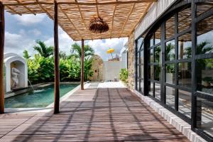 an external view of a villa with a swimming pool at Tresna Villa Tumbak Bayuh Utara in Dalung