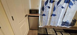 a door to a room with a trash can next to it at Single Room in Townhouse in Manassas