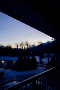 a view of a winter sunset from a balcony at Rainbow INN in Terrace