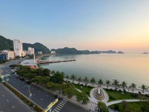 an aerial view of a city and a body of water at Cat Ba Bay Vision Hotel in Cat Ba