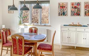 a dining room table and chairs in a kitchen at 2 Bedroom Awesome Home In Faaborg in Faaborg
