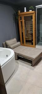 a bathroom with a toilet and a sink and a cabinet at Sea 1 Spa&Wellness in Civitanova Marche +18 photos