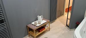 a table with a vase on top of it at Sea 1 Spa&Wellness in Civitanova Marche