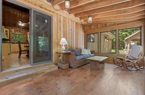 a living room with a couch and a table at STARGAZER SHORES LIMIT 8 villa in Bridgton