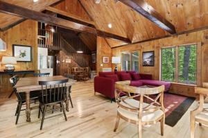 a living room with a couch and a table at STARGAZER SHORES LIMIT 8 villa in Bridgton
