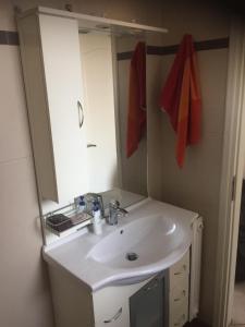 a bathroom with a sink and a mirror at STUDIO WITH SEA VIEW - KYPARISSIA beach in Kyparissia +14 photos