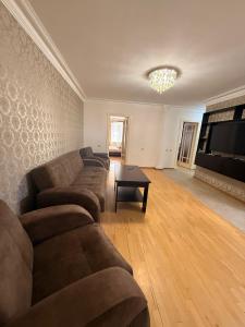 a living room with a couch and a table at Comfortable zone in Yerevan
