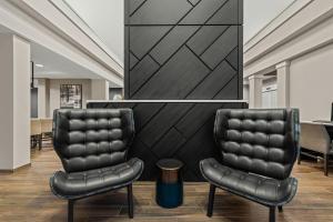 two black leather chairs in a waiting room at Residence Inn Paducah in Paducah