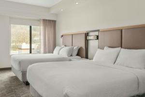 a hotel room with two beds and a window at SpringHill Suites by Marriott Morgantown in Morgantown +11 photos