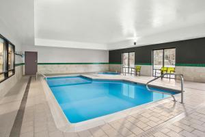 a pool with blue water in a building at SpringHill Suites by Marriott Morgantown in Morgantown