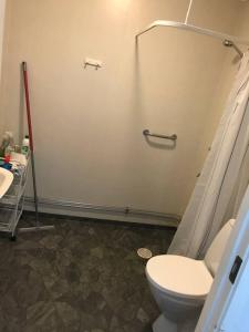 a bathroom with a toilet and a sink at Workers Stay - Furnished Housing Umeå Sverige in Klabböle