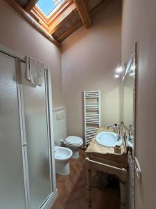 a bathroom with a sink and a toilet and a shower at Colle dei Falchi in Fermo +29 photos