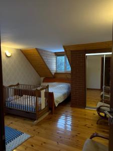 a bedroom with a bed and a staircase in a room at DOM U Stefanów - Królowy Most in Królowy Most