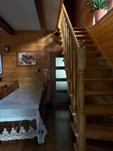 a room with a staircase with a bed and a stair case at DOM U Stefanów - Królowy Most in Królowy Most