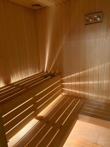 a small wooden sauna with the light shining on it at DOM U Stefanów - Królowy Most in Królowy Most