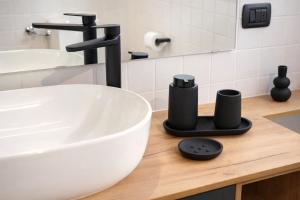 a bathroom counter with a sink and aaucet at Ca' Dei Coppi in Solignano Nuovo +20 photos