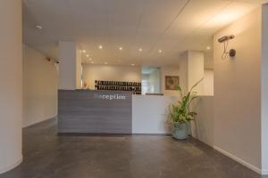 a lobby with a reception desk in a building at Residence Hotel Siloe in Milan